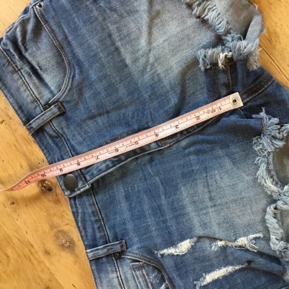 29” STS Blue jean shorts feature a distressed design with a dark blue wash - Picture 7 of 8